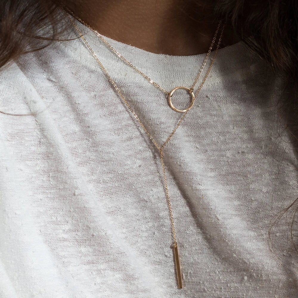 Collier Éclipse – Chaîne Y Minimaliste en Acier Inoxydable Doré